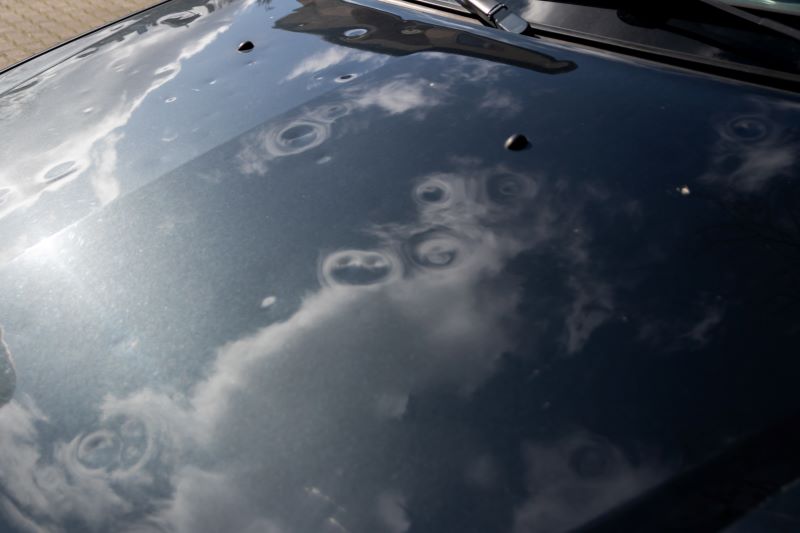 hail damage to the hood of a car